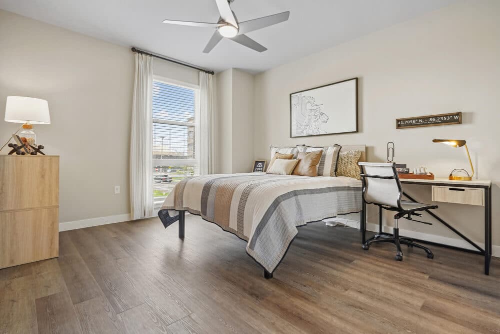 bedroom with desk near bed
