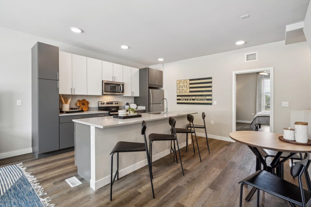kitchen and dining room, new countertops, bar stools and notre dame university decoration