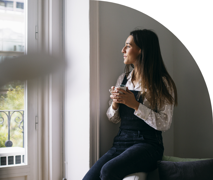Woman looking out window