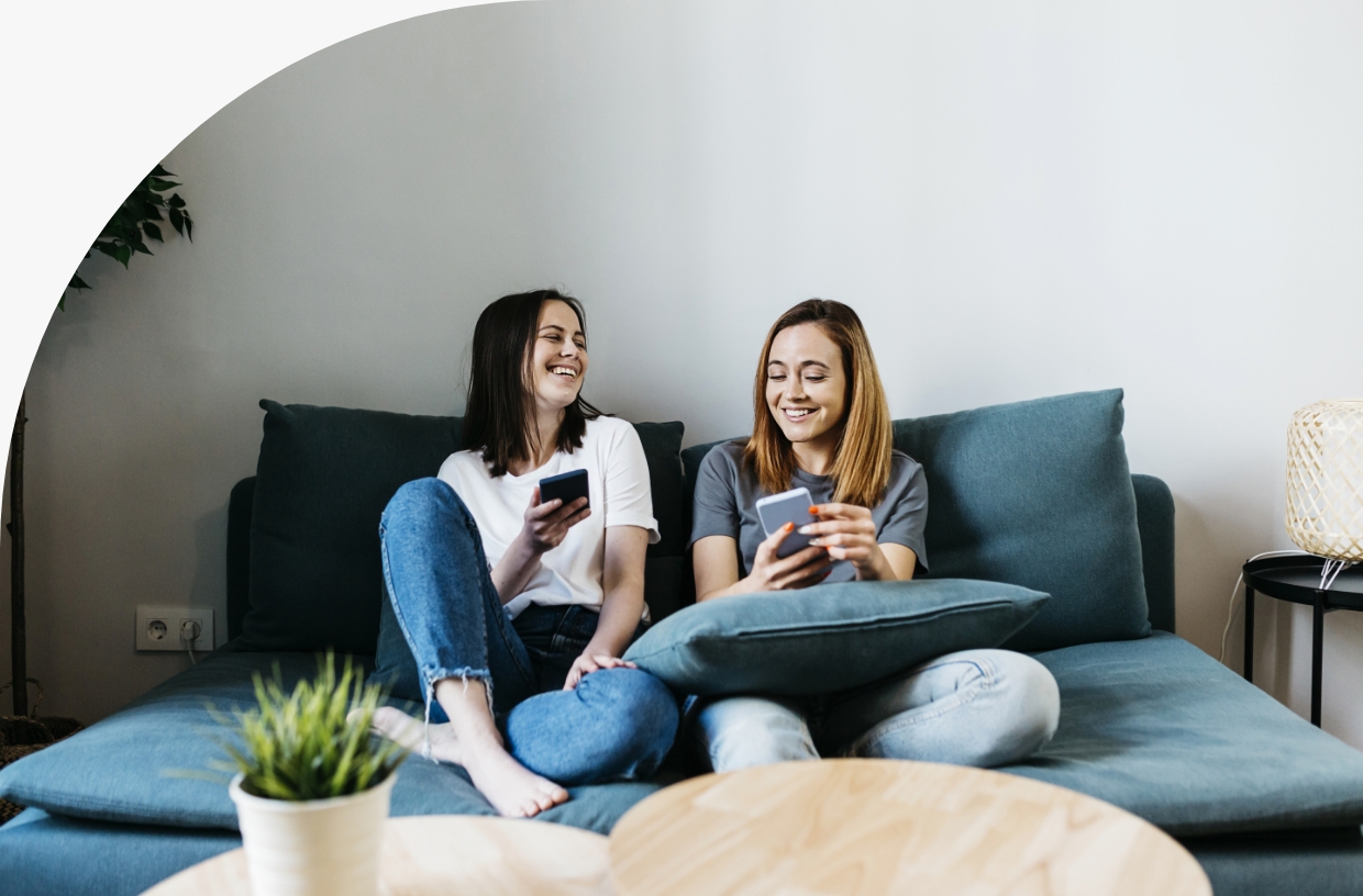 Girls laughing on couch
